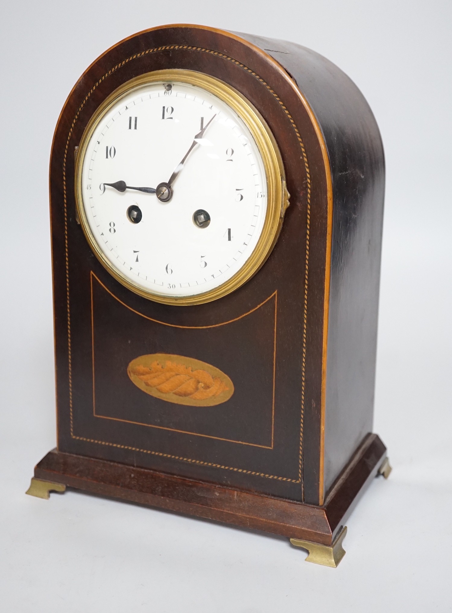 An Edwardian brass mounted mantel clock, 28.5cms high